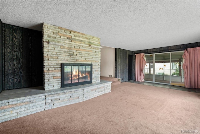 3301 S Kearsley Blvd, Flint, MI 48506 - unfurnished living room with carpet flooring, a textured ceiling, and a fireplace