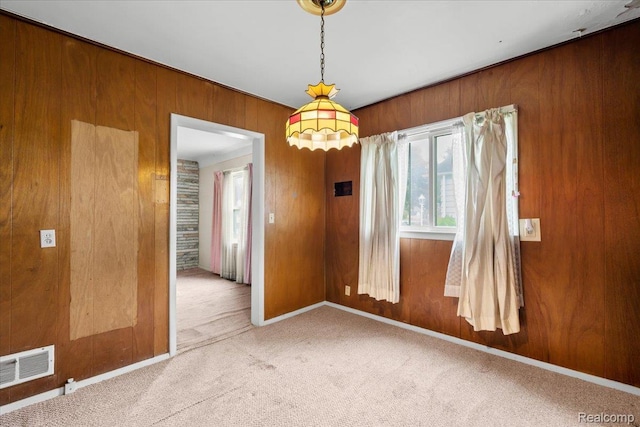 3301 S Kearsley Blvd, Flint, MI 48506 - carpeted empty room with wood walls and baseboards