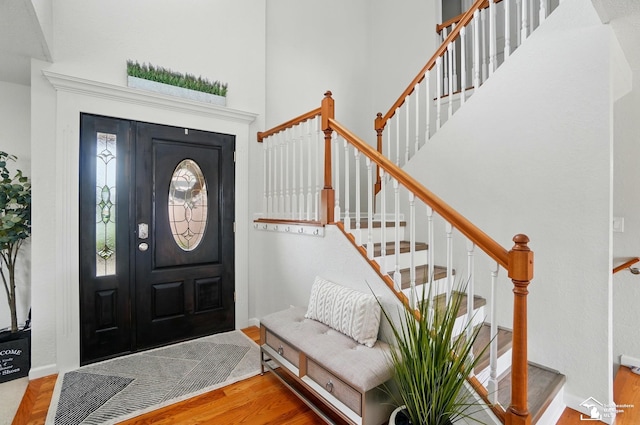 4853 Southpointe Pkwy, Monroe, MI 48161 - foyer entrance with wood finished floors, stairs, and a towering ceiling