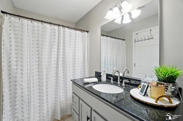 4853 Southpointe Pkwy, Monroe, MI 48161 - bathroom featuring vanity, a chandelier, and a shower with shower curtain