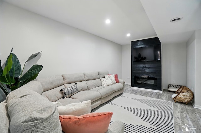4853 Southpointe Pkwy, Monroe, MI 48161 - living area with wood finished floors, baseboards, recessed lighting, and a fireplace