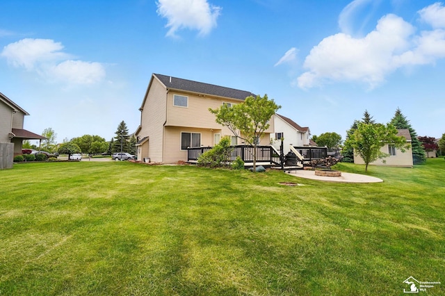4853 Southpointe Pkwy, Monroe, MI 48161 - back of property featuring a fire pit, a wooden deck, and a yard