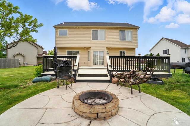 4853 Southpointe Pkwy, Monroe, MI 48161 - rear view of house featuring a fire pit, a deck, and a patio area