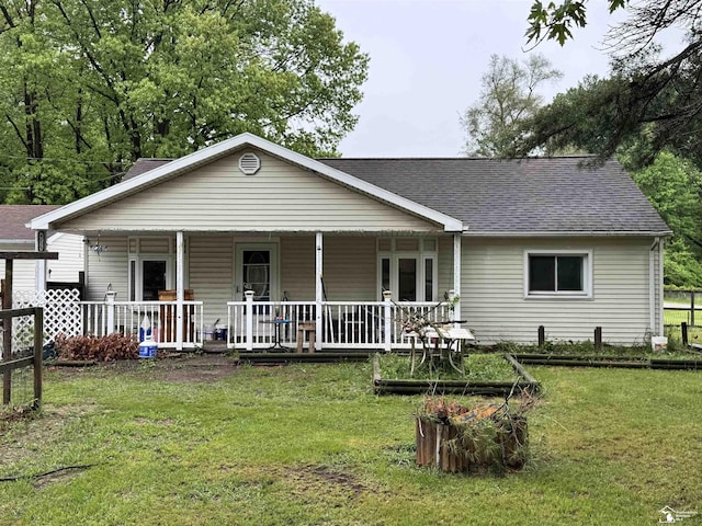 4211 Shelton Dr, Lambertville, MI 48144 - view of front of house with a shingled roof, a porch, and a front lawn