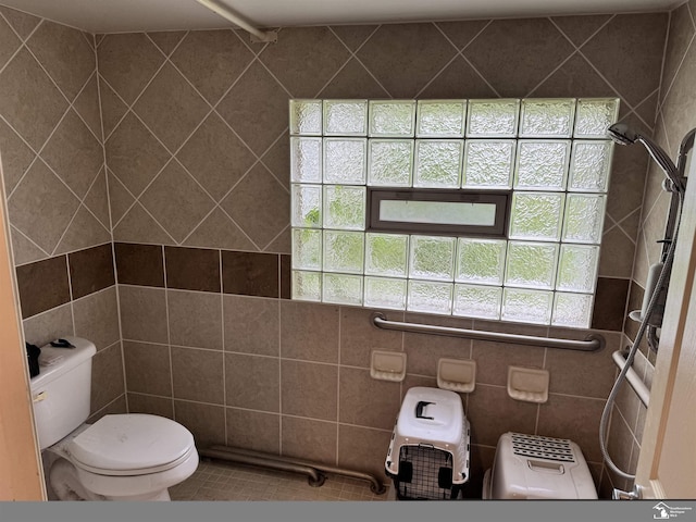 4211 Shelton Dr, Lambertville, MI 48144 - full bath with toilet, tile walls, tile patterned flooring, and a shower