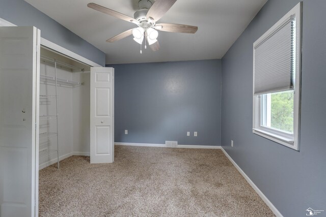 6432 Whiteford Center Rd, Lambertville, MI 48144 - unfurnished bedroom featuring carpet flooring, a closet, baseboards, and ceiling fan