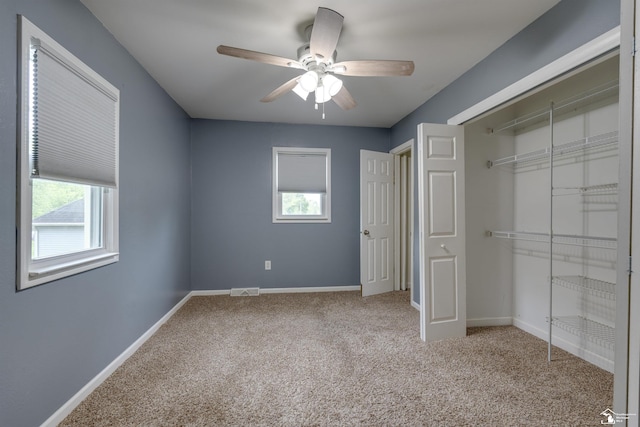 6432 Whiteford Center Rd, Lambertville, MI 48144 - unfurnished bedroom featuring carpet flooring, baseboards, a closet, and ceiling fan