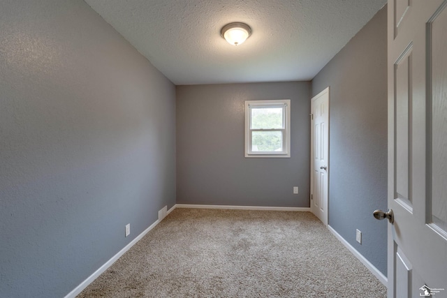 6432 Whiteford Center Rd, Lambertville, MI 48144 - carpeted spare room featuring a textured ceiling and baseboards