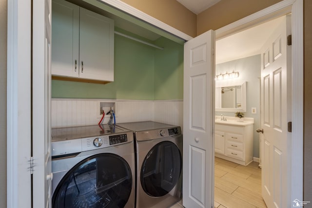6432 Whiteford Center Rd, Lambertville, MI 48144 - laundry area featuring washing machine and dryer, a wainscoted wall, and wood tiled floors