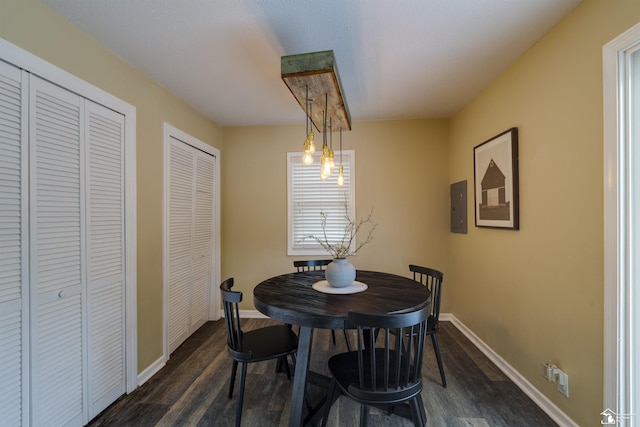 6432 Whiteford Center Rd, Lambertville, MI 48144 - dining space with dark wood finished floors, electric panel, and baseboards