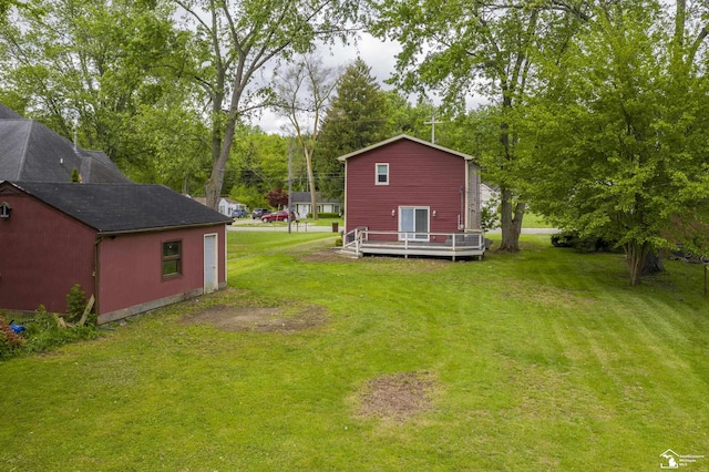 6432 Whiteford Center Rd, Lambertville, MI 48144 - view of grassy yard featuring a wooden deck and an outdoor structure