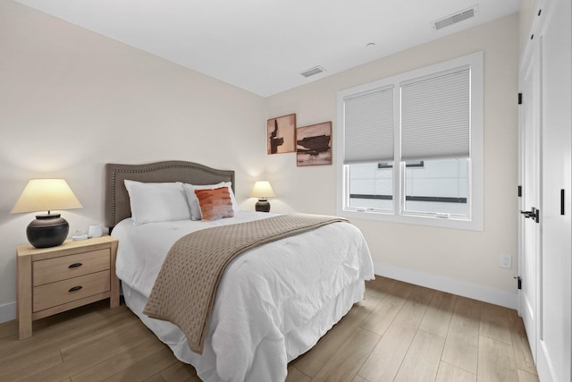 708 Randolph St, Traverse City, MI 49684 - bedroom featuring baseboards and wood finished floors
