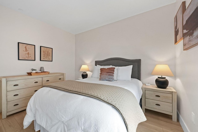 708 Randolph St, Traverse City, MI 49684 - bedroom with light wood-style flooring and baseboards