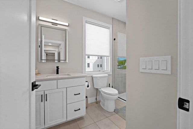 708 Randolph St, Traverse City, MI 49684 - full bathroom featuring vanity, toilet, a shower stall, and tile patterned flooring