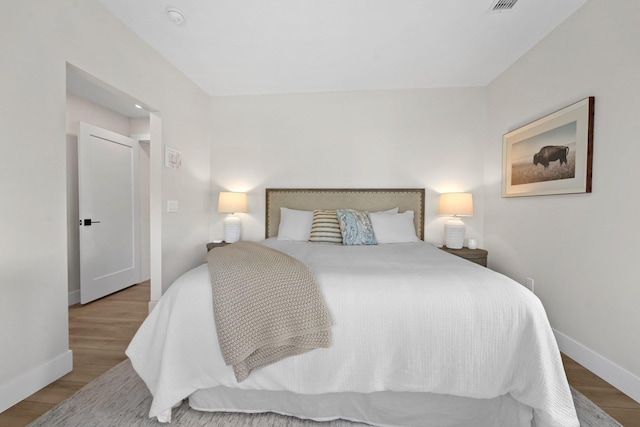 708 Randolph St, Traverse City, MI 49684 - bedroom with baseboards and wood finished floors