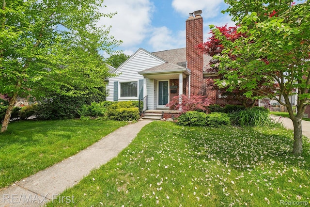 2681 Buckingham Ave, Birmingham, MI 48009 - bungalow-style house with a front lawn and a chimney