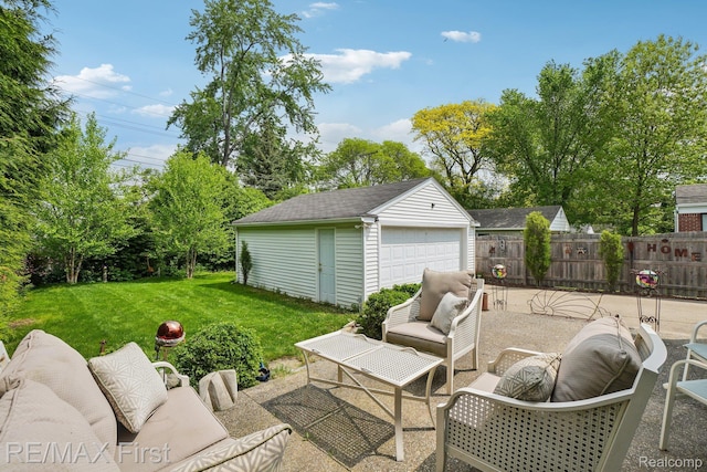 2681 Buckingham Ave, Birmingham, MI 48009 - view of patio with an outdoor hangout area, an outbuilding, and a garage