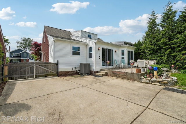2681 Buckingham Ave, Birmingham, MI 48009 - back of property featuring a patio, a gate, central AC, and roof with shingles
