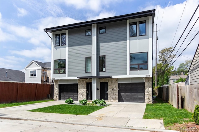 123 Mason Ct Unit 2, Royal Oak, MI 48067 - townhome / multi-family property with stone siding, driveway, and a garage