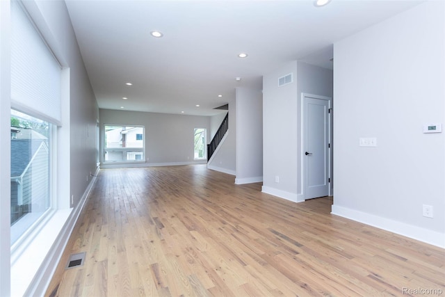 123 Mason Ct Unit 2, Royal Oak, MI 48067 - unfurnished living room with plenty of natural light, light wood-type flooring, recessed lighting, and baseboards