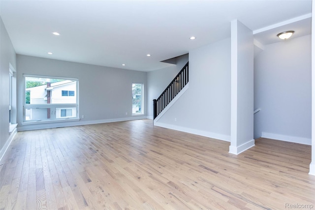 123 Mason Ct Unit 2, Royal Oak, MI 48067 - unfurnished living room featuring light wood finished floors, plenty of natural light, baseboards, and recessed lighting