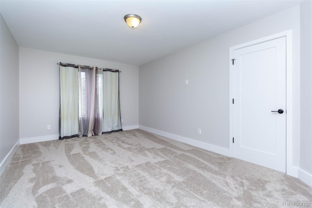 123 Mason Ct Unit 2, Royal Oak, MI 48067 - spare room with carpet floors and baseboards