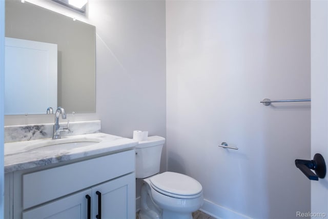 123 Mason Ct Unit 2, Royal Oak, MI 48067 - bathroom featuring vanity, toilet, and baseboards