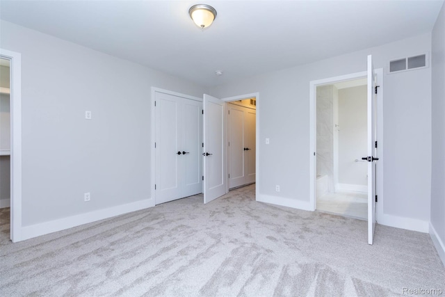 123 Mason Ct Unit 2, Royal Oak, MI 48067 - unfurnished bedroom featuring carpet floors, baseboards, connected bathroom, and a closet