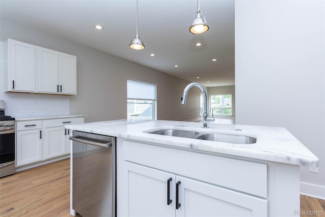 123 Mason Ct Unit 2, Royal Oak, MI 48067 - kitchen with a sink, appliances with stainless steel finishes, light wood finished floors, recessed lighting, and white cabinetry