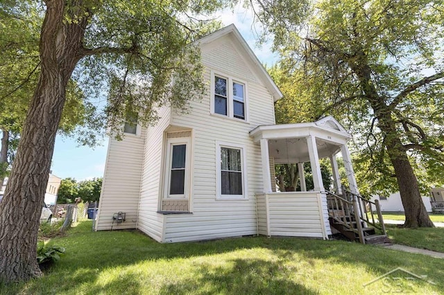 1221 Marsac St, Bay City, MI 48708 - view of side of property featuring a lawn and stairs
