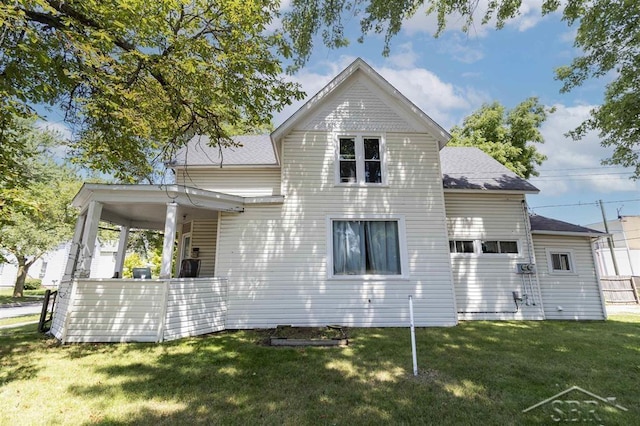 1221 Marsac St, Bay City, MI 48708 - back of house featuring a yard and a shingled roof