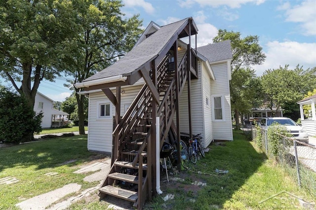 1221 Marsac St, Bay City, MI 48708 - view of side of home with stairs and a shingled roof