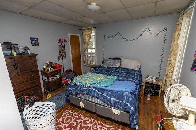 1221 Marsac St, Bay City, MI 48708 - bedroom featuring a paneled ceiling and wood finished floors