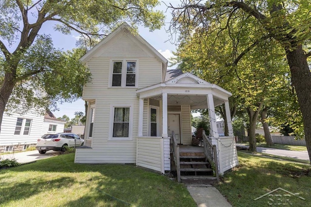 1221 Marsac St, Bay City, MI 48708 - view of front facade with a front lawn and a porch