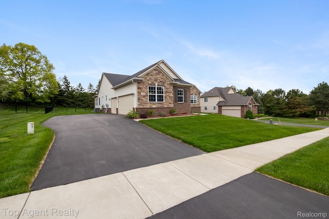 109 Willow Lake Dr, Oxford, MI 48371 - craftsman house with stone siding, a front yard, asphalt driveway, and a garage