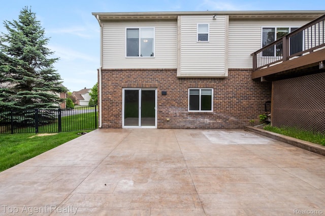 109 Willow Lake Dr, Oxford, MI 48371 - rear view of property featuring brick siding and a patio area