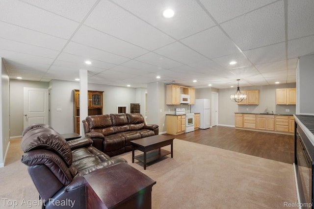 109 Willow Lake Dr, Oxford, MI 48371 - living room with dark carpet, recessed lighting, a chandelier, baseboards, and a paneled ceiling