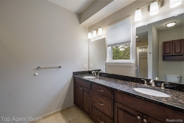 109 Willow Lake Dr, Oxford, MI 48371 - full bath with double vanity, tile patterned floors, a stall shower, toilet, and baseboards