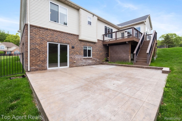 109 Willow Lake Dr, Oxford, MI 48371 - back of property with brick siding, a wooden deck, a patio, and stairs