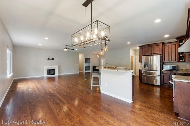 109 Willow Lake Dr, Oxford, MI 48371 - kitchen with stainless steel appliances, recessed lighting, a ceiling fan, dark wood-style flooring, and baseboards