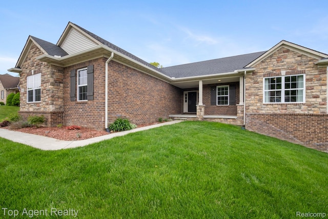 109 Willow Lake Dr, Oxford, MI 48371 - view of front of home with a front lawn, brick siding, a porch, and a shingled roof