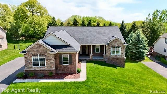 109 Willow Lake Dr, Oxford, MI 48371 - view of front of house featuring stone siding and a porch
