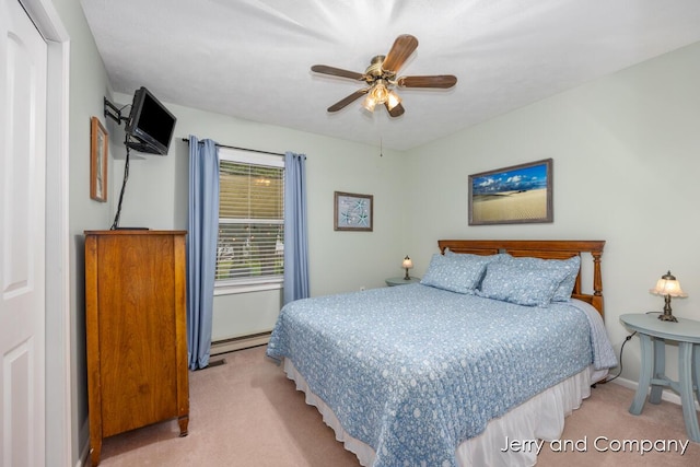 2058 N White Birch Dr, Mears, MI 49436 - bedroom with light colored carpet, ceiling fan, and baseboards