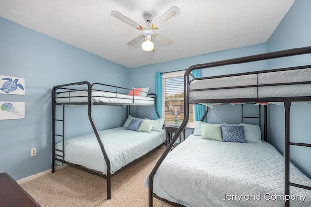 2058 N White Birch Dr, Mears, MI 49436 - carpeted bedroom with baseboards and a ceiling fan