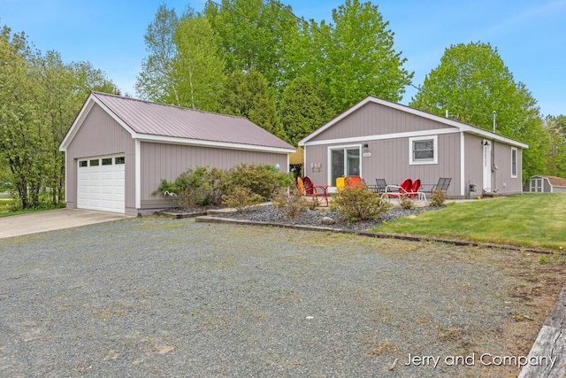2058 N White Birch Dr, Mears, MI 49436 - ranch-style home with an outdoor structure, a front lawn, and concrete driveway