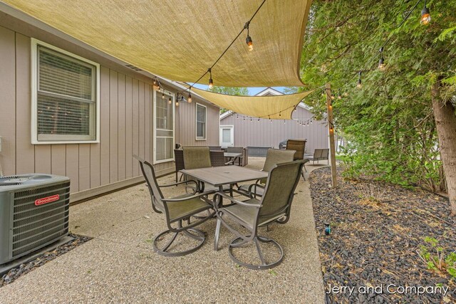 2058 N White Birch Dr, Mears, MI 49436 - view of patio / terrace with central AC and outdoor dining space