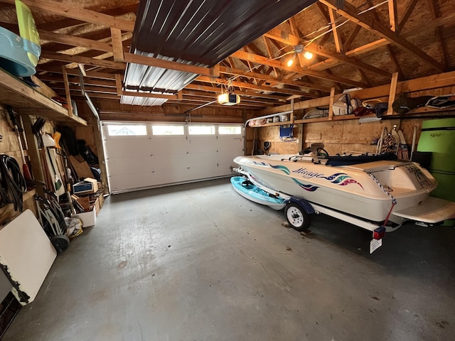 2058 N White Birch Dr, Mears, MI 49436 - garage featuring a garage door opener