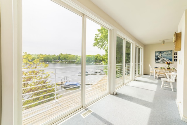 15657 Lakeview Dr, Buchanan, MI 49107 - unfurnished sunroom featuring a water view and carpet