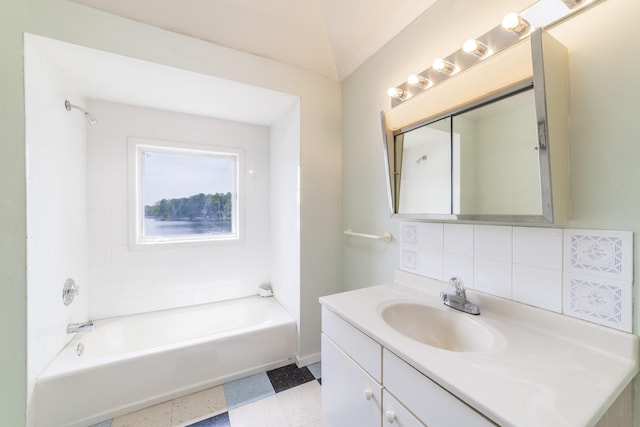 15657 Lakeview Dr, Buchanan, MI 49107 - bathroom with vanity, shower / bathtub combination, backsplash, and tile patterned floors
