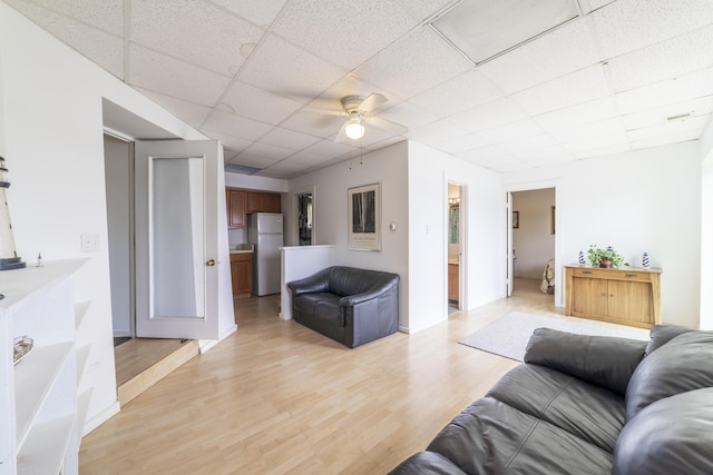 15657 Lakeview Dr, Buchanan, MI 49107 - living room with a paneled ceiling, light wood-type flooring, ceiling fan, and baseboards